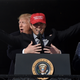 President Donald Trump fondles baseball player Kurt Suzuki at the White House on November 4, 2019. Not from the White House Flickr account.
